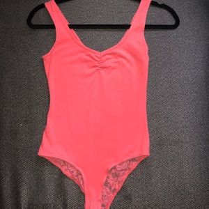 Pink bodysuit with lace back